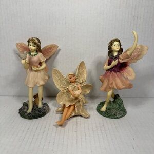 Decorative vintage elephants with raised trunks, silver and white